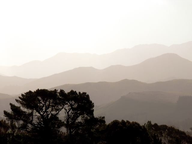 Canterbury foothills with layered mountain ridges in misty light New Zealand