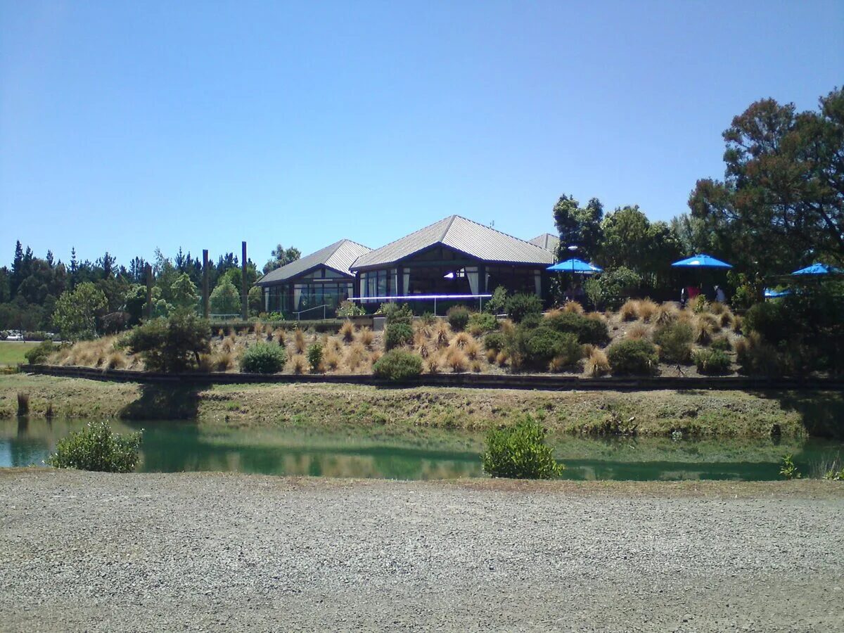Orana Wildlife Park lodge building with native plantings and pond Christchurch New Zealand