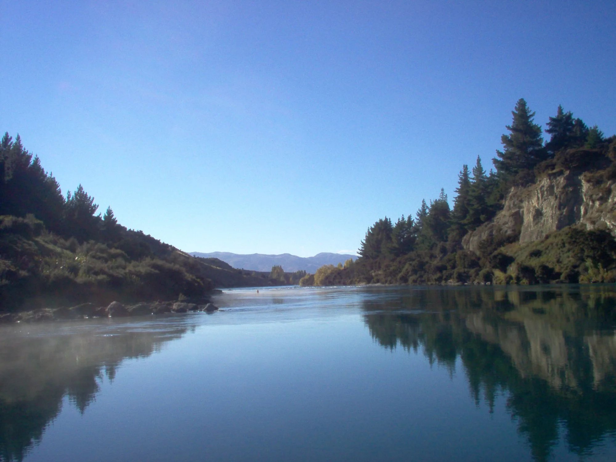 The mouth of the mighty Clutha River near Wanaka in autumn with mist rising New Zealand