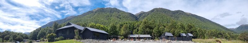 Maruia Springs lodge with mountains and native bush Lewis Pass New Zealand