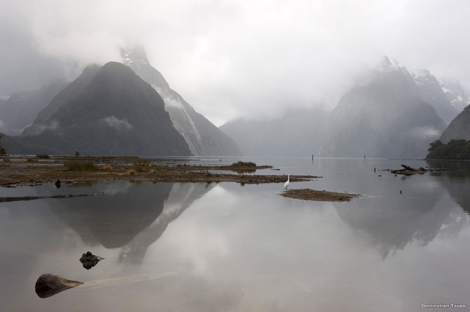 Milford Sound with Mitre Peak reflected in still water Fiordland
