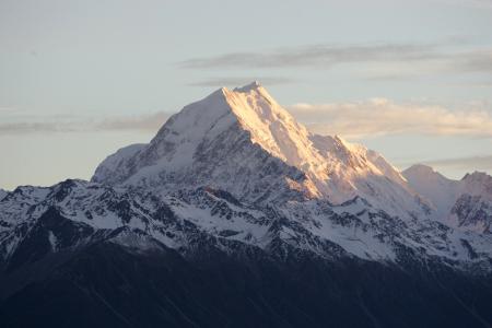 Aoraki Mt Cook summit glowing at sunset with snow-covered Southern Alps