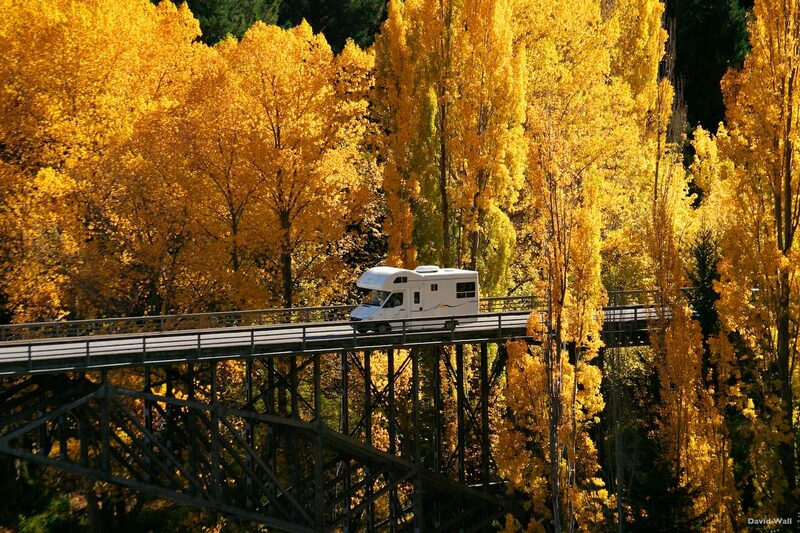 Campervan crossing Kawarau Bridge autumn New Zealand