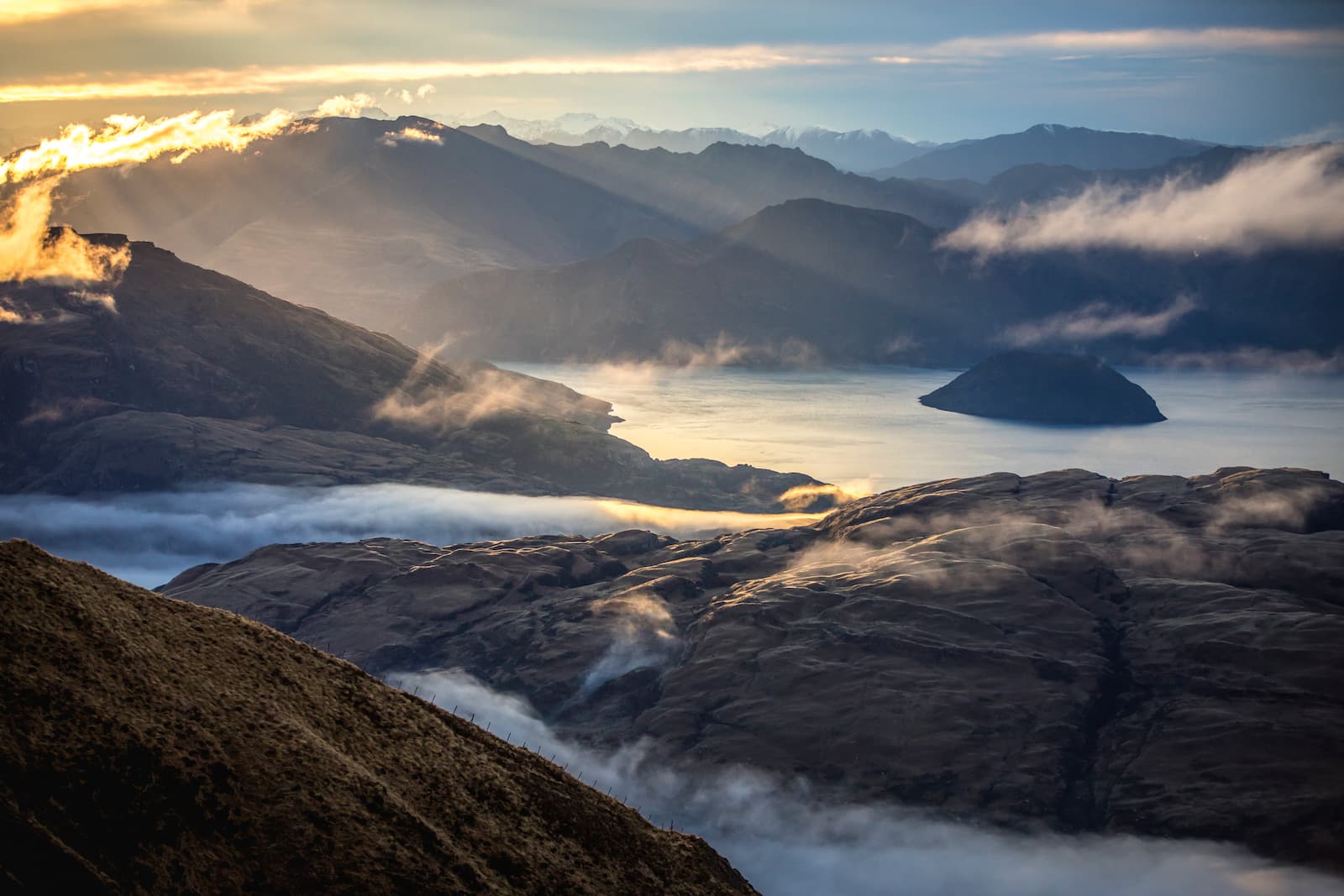 Sunrise above clouds from Treble Cone looking over Lake Wanaka
