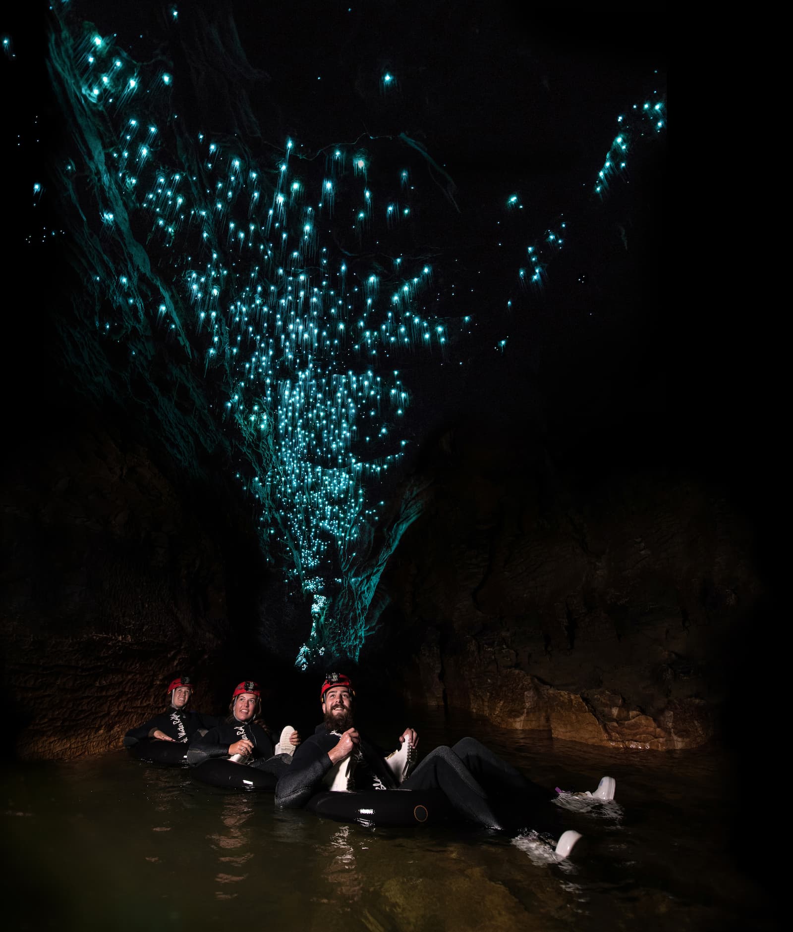 Black water rafting through glowworm caves Waitomo on inner tubes