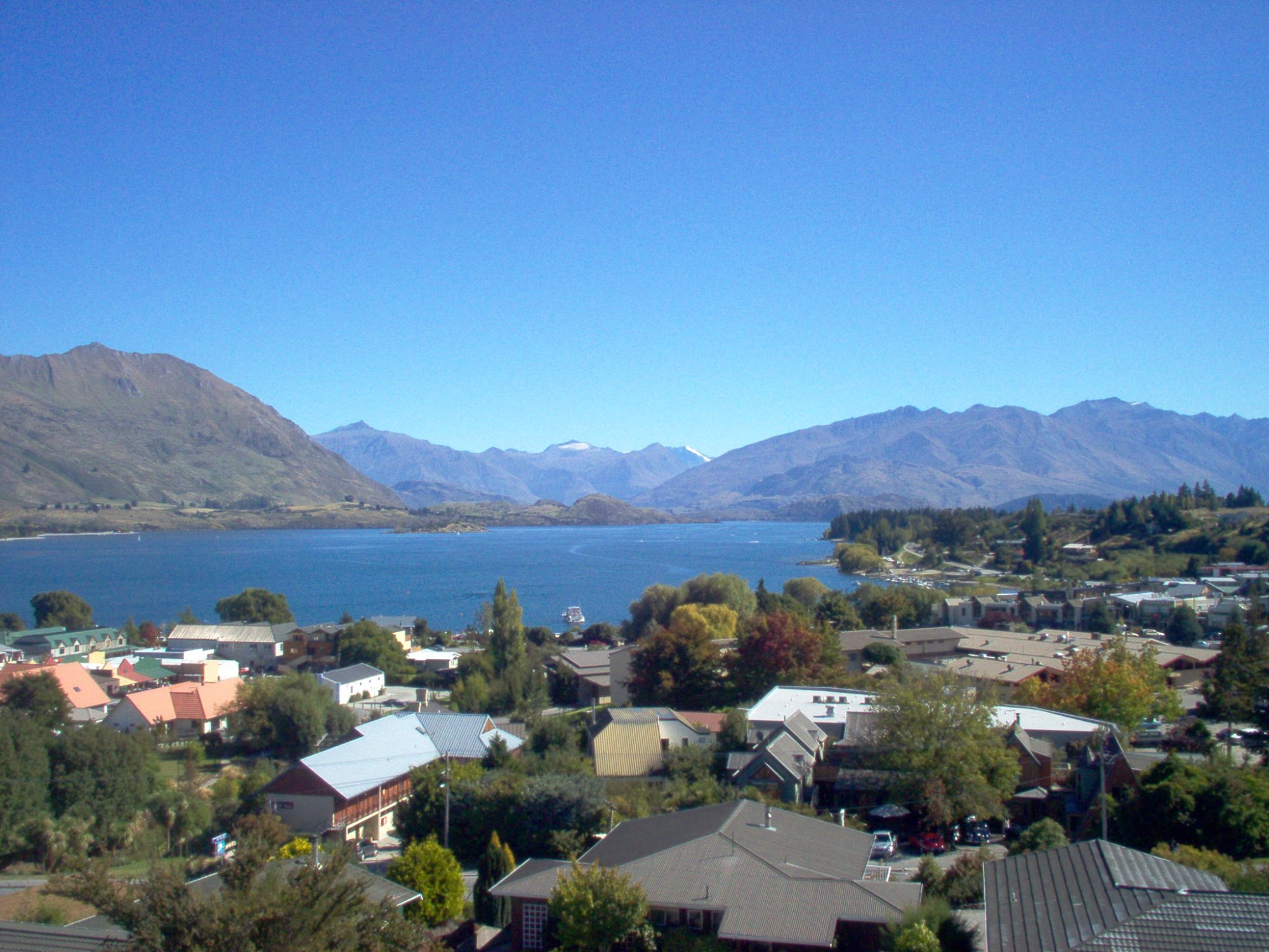 Wanaka township looking up the lake towards mountains and Southern Alps New Zealand